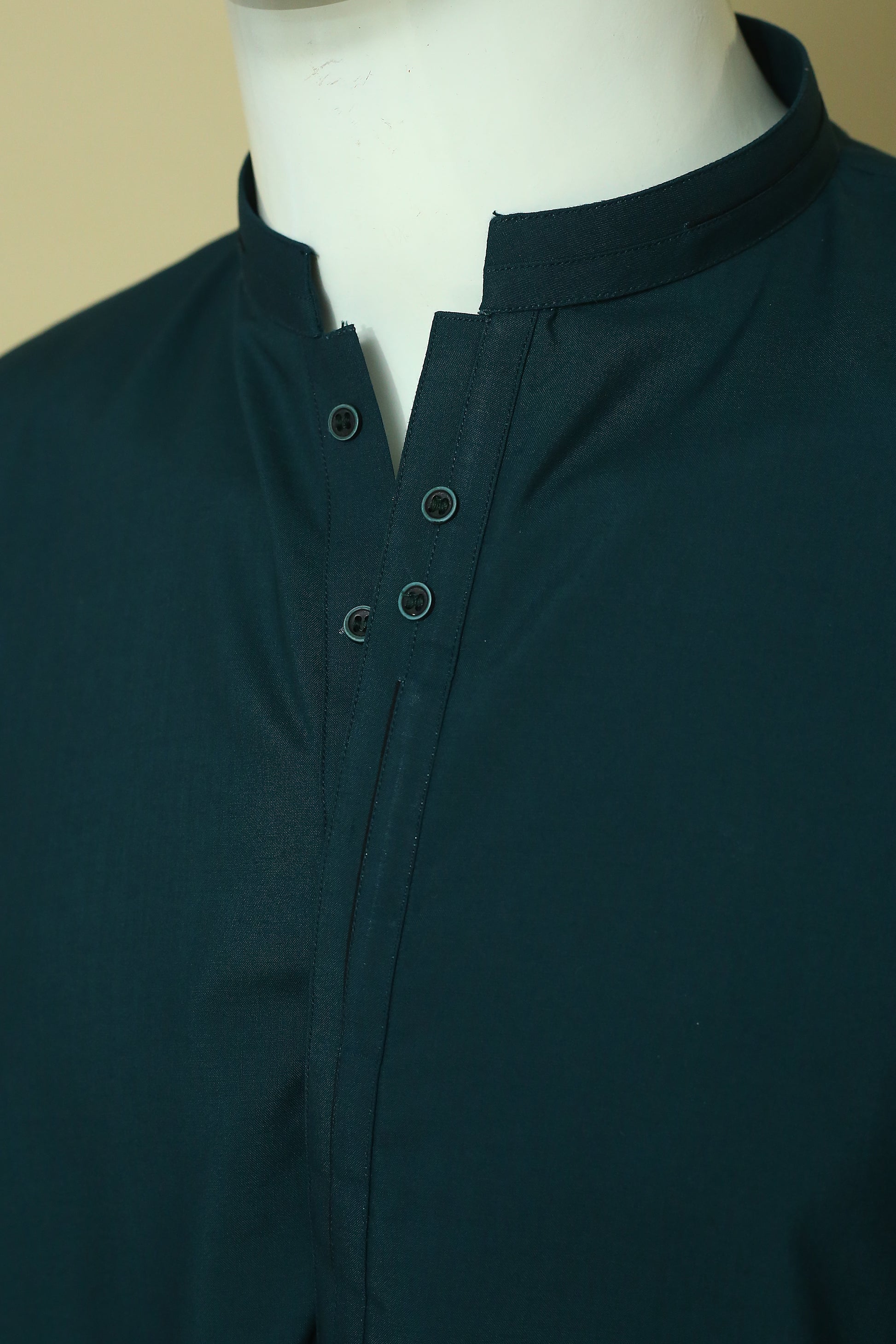 Premium Green Shalwar Qameez with sherwani-style collar and patti work. Soft, breathable wash n wear fabric perfect for daily and event wear.